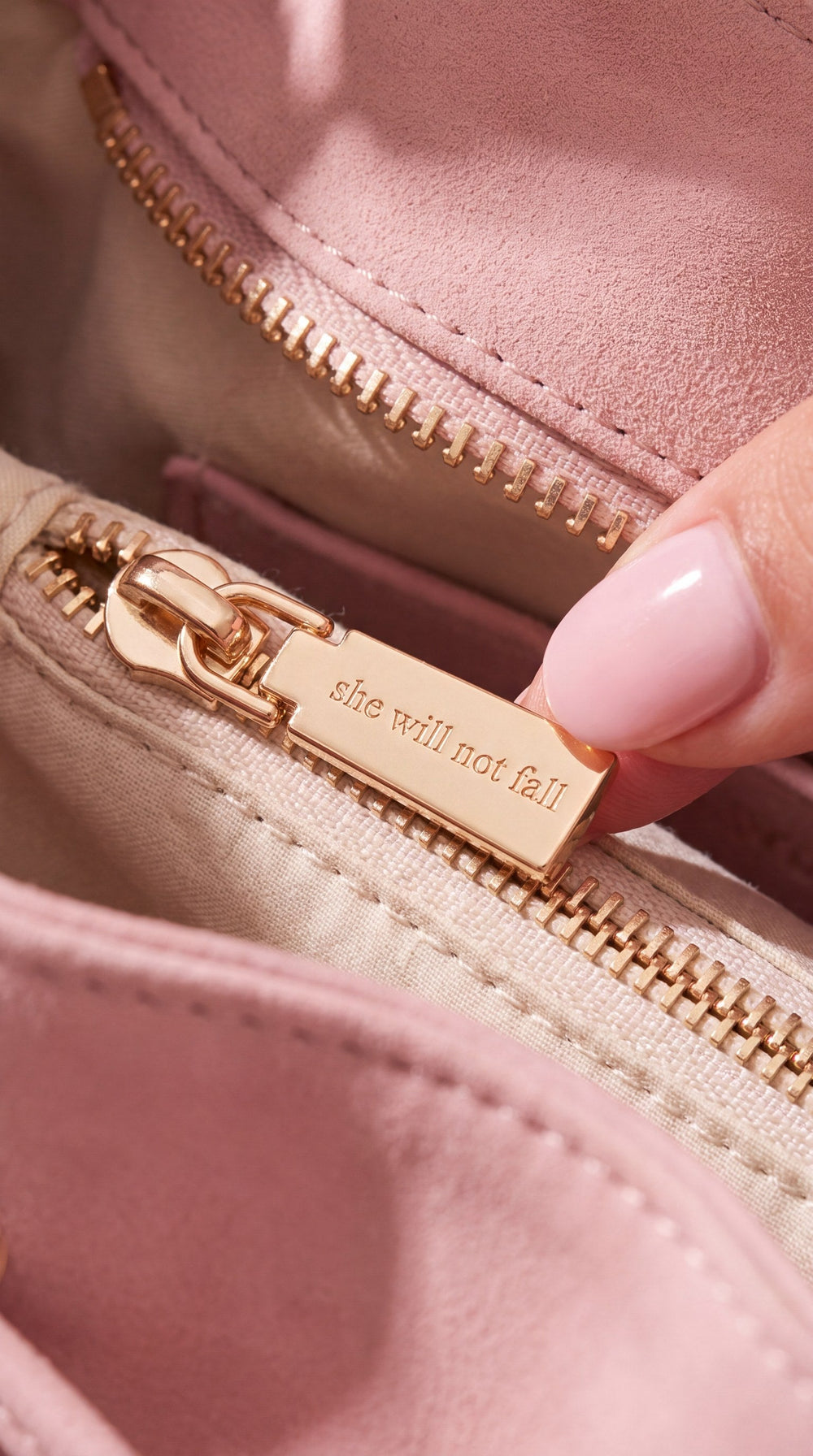Rose-gold zipper pull engraved she will not fall