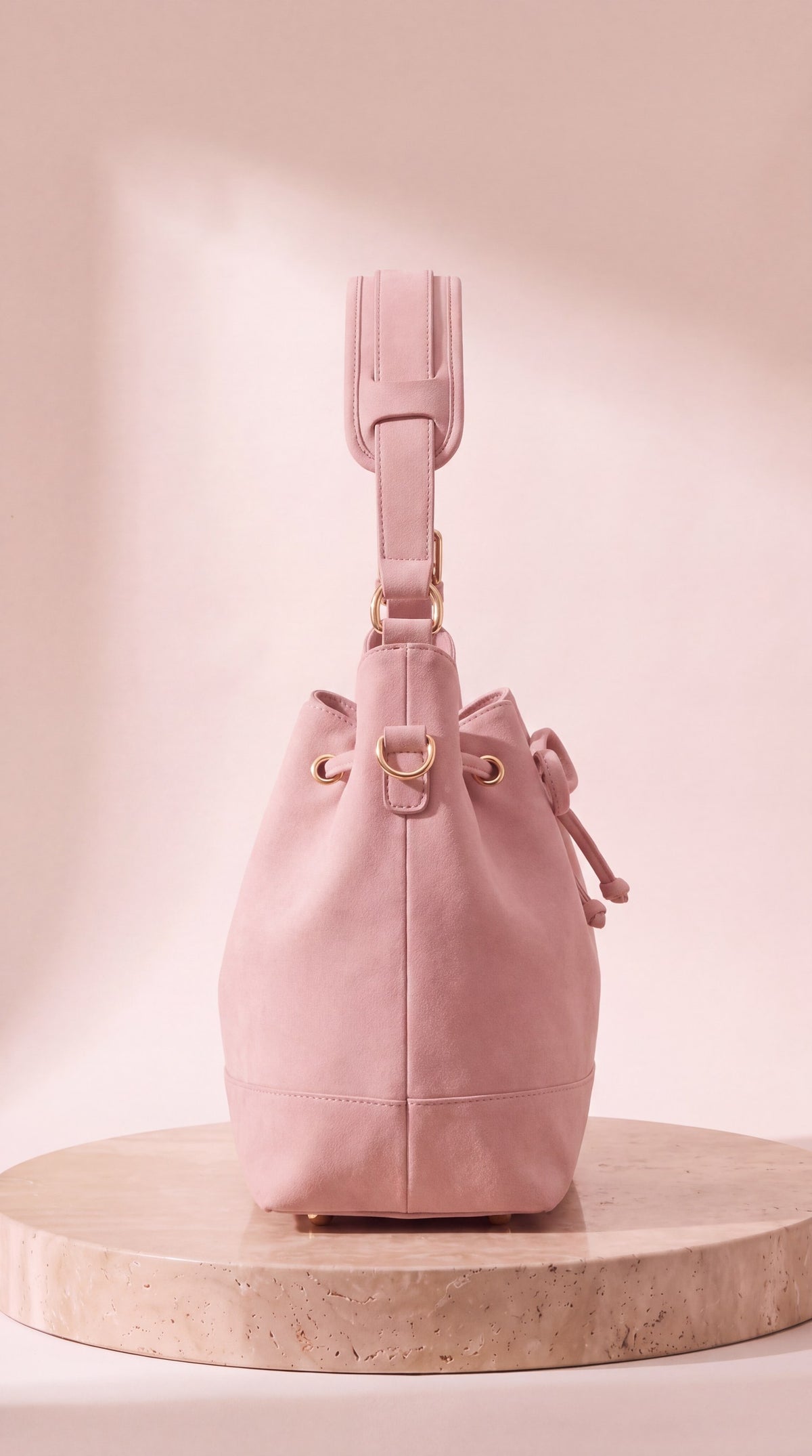 Side view of the 46:5 Bag in blush pink suede